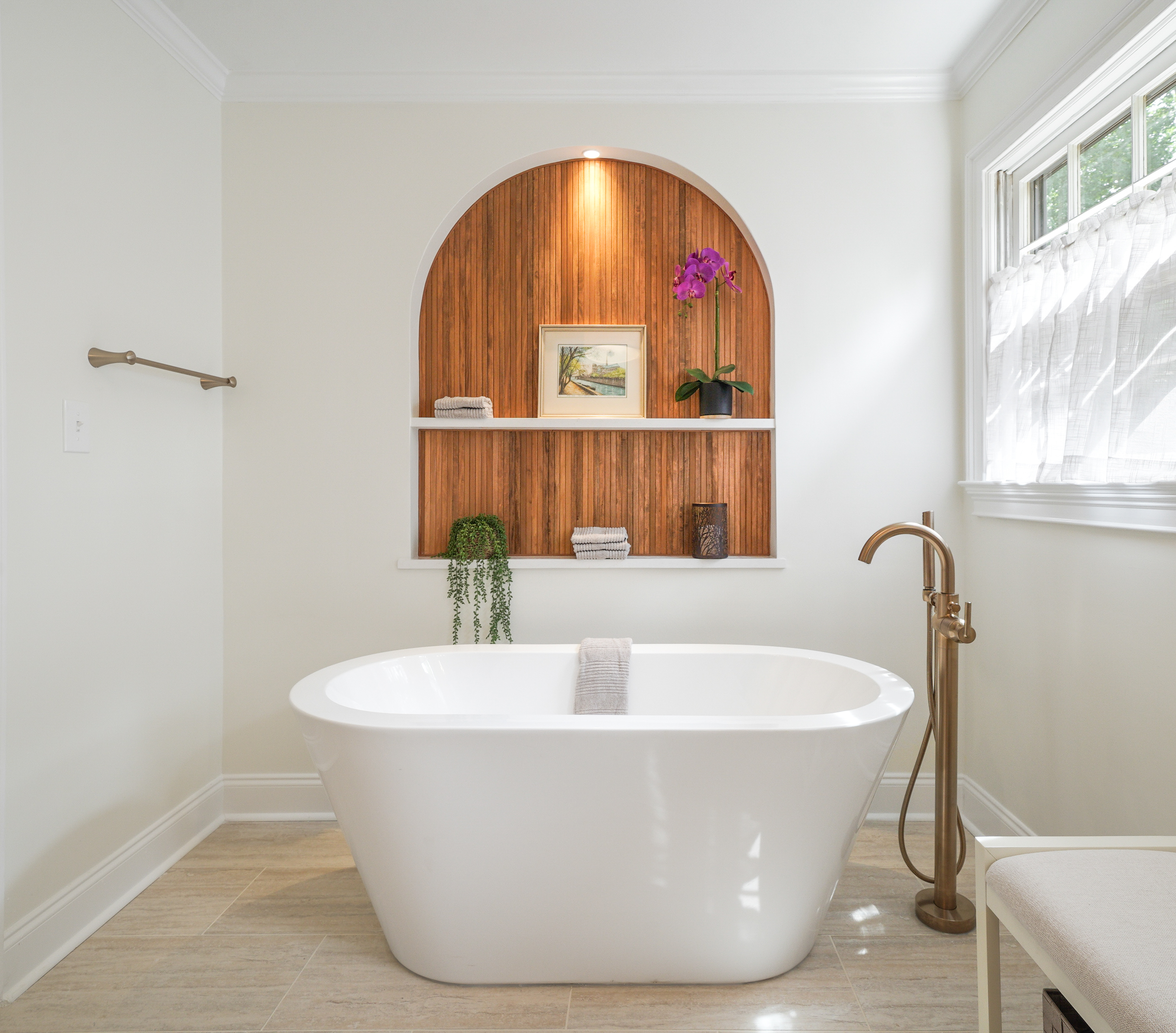 Elegant bathroom with custom built-in shelving