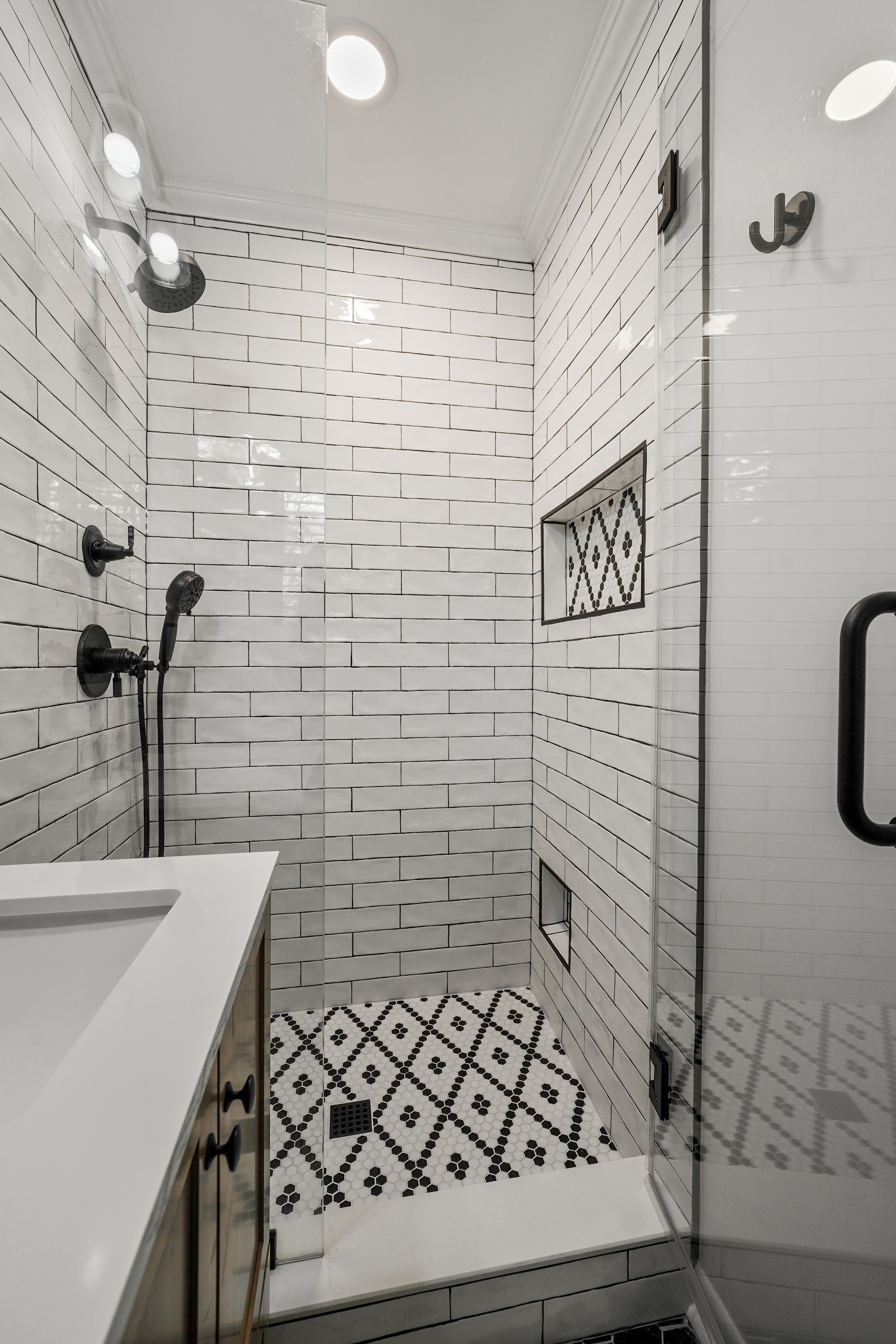 Modern shower with subway tile and custom niche